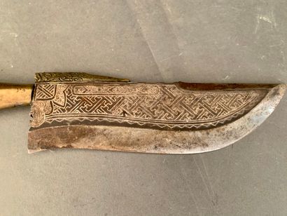 null Knife, iron blade worked with geometrical patterns, wooden handle.

Tibet or...