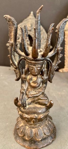 null Lot comprising: a sitting bronze Buddha, two metal mandorles, a top mandorle...
