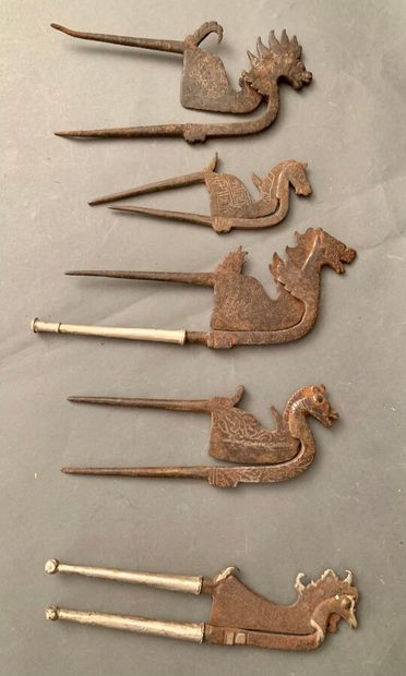 null Five incised iron betel scissors with horse head decoration.

Indonesia.

L....