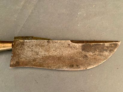 null Knife, iron blade worked with geometrical patterns, wooden handle.

Tibet or...