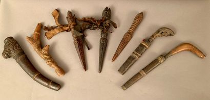 null Lot including: three carved wooden shamanic Phurbu, two small daggers, iron...
