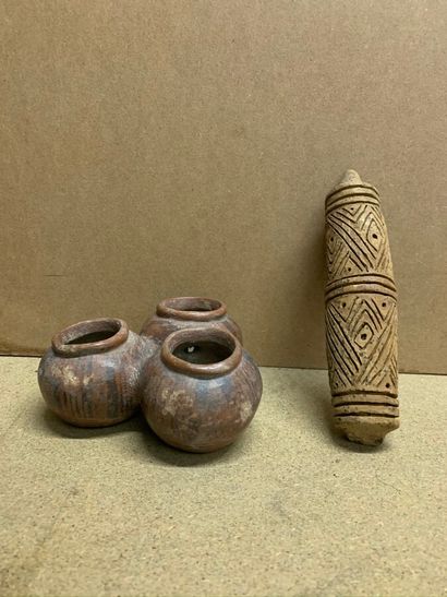 null Three small terracotta vases and a Selos roll in incised terracotta.

Central...