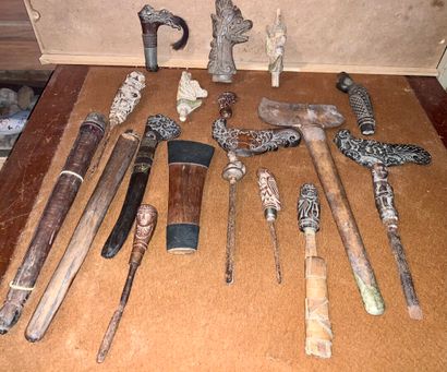 null Lot including: several kriss or dagger handles, two carved wooden kriss sheaths,...
