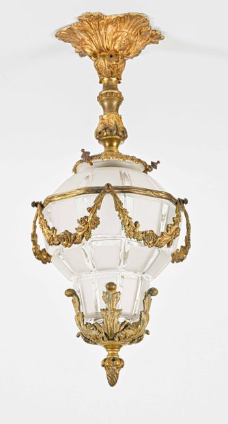 SUSPENSION in chased gilt bronze of acanthus and garlands of flowers set in a faceted...