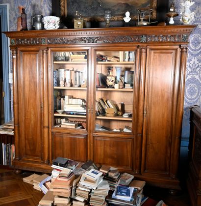 null Moulded and carved walnut bookcase with a pediment of swans and foliage, inlaid...