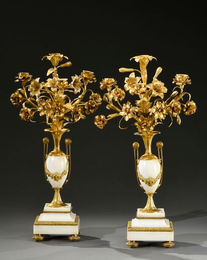 null Pair of white marble and gilt bronze candelabra in the form of an urn, with...