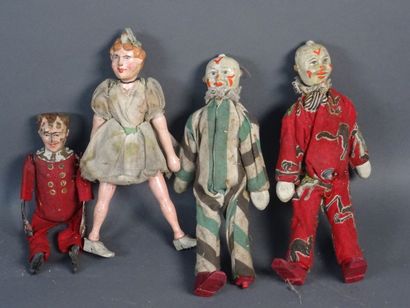 null Lot of four characters including :

- two clowns in composition and painted...