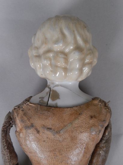 null Parian doll, head and bust in bisque, moulded hair, painted features, body in...