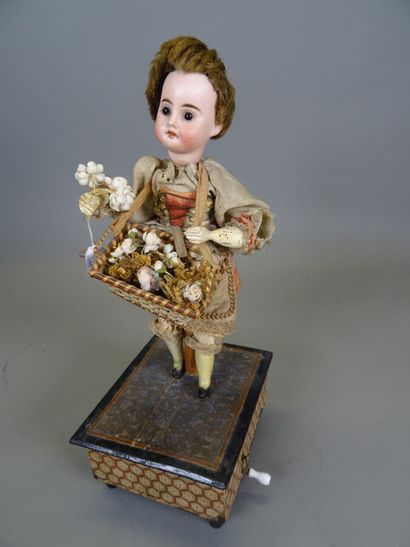 null Antique wind-up automaton "La marchande de fleurs", German bisque head doll...