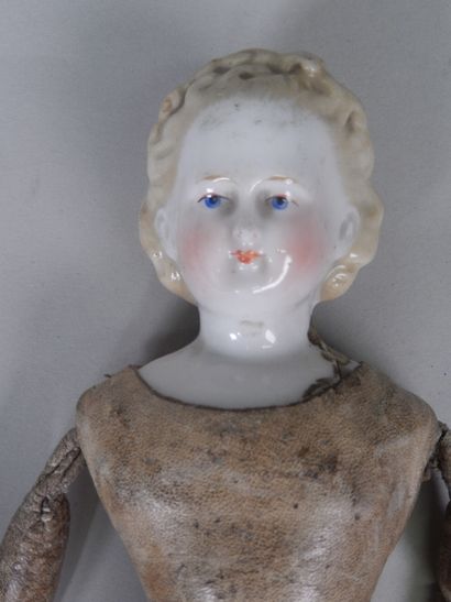 null Parian doll, head and bust in bisque, moulded hair, painted features, body in...