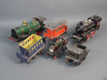 null Lot de trains échelles O et 1 comprenant trois locomotives et 5 wagons.

On...