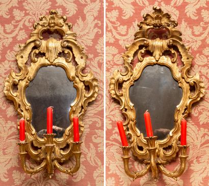 null Pair of giltwood mirrors with openwork, shell and palmette pediment. Fitted...