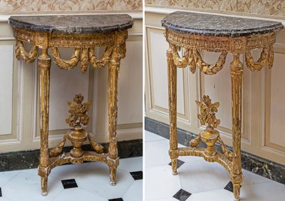 null Pair of small half-moon consoles in gilded wood; the belt with acanthus leaves...