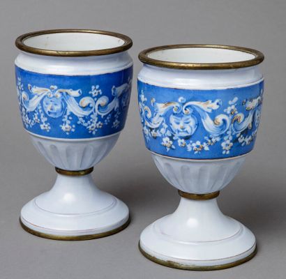 null Pair of ceramic baluster vases with flower and mascot friezes on a blue background....