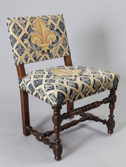 null Walnut chair with a low upholstered back, the turned baluster base with blackened...