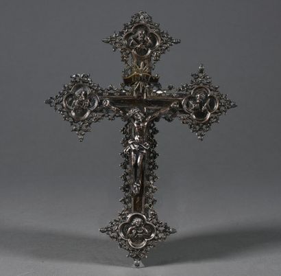 null Cross in silver plated metal, finely openwork, the four branches finished with...