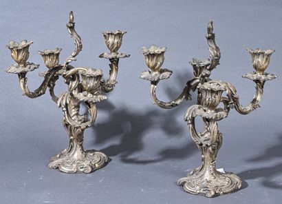 null Pair of rocaille bronze table ends with four asymmetrical foliated light arms...