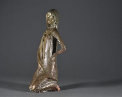 null Kneeling woman

Terracotta with a patina in imitation of bronze

Bears a label...