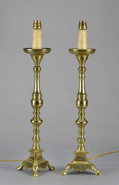 null Pair of bronze or brass pikes. Triangular base with skids monogrammed "C.L.V.".

19th...