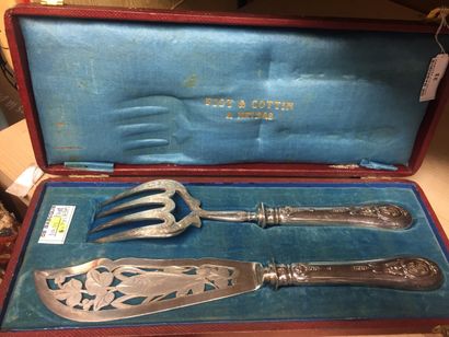 null Fish service cutlery, the handles in filled silver decorated with medallions...