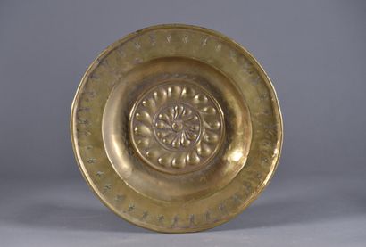 null Brass offering dish, the umbilicus decorated with embossed twisted gadroons,...