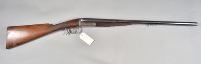 null ****FRANCE

Shotgun 

Caliber 12 

Wooden stock with checkering, bronzed side-by-side...