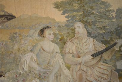 null Tapisserie à décor d'un couple galant assis dans un paysage, lui jouant du luth,...