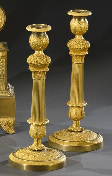 null Very beautiful pair of gilt bronze torches chased with foliage and garlands...