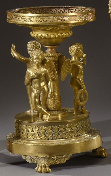 null A rare ormolu table centrepiece on a round base with a frieze of water leaves...