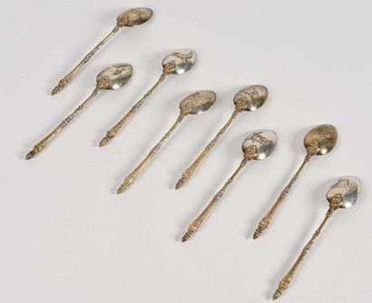 null Eight vermeil mocha spoons, with partially foliated column handle, the spoons...