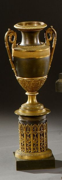 null An ormolu and patinated urn-shaped decorative vase, with fluted mouldings, pearls,...
