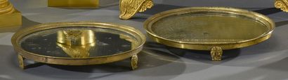null Pair of small round trays with a mirror back, the gilt bronze mounting with...