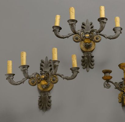 null A pair of important patinated and gilt bronze sconces with four foliated arms...