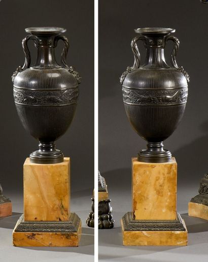 null A pair of large antique bronze vases with a dark patina, baluster shape, with...