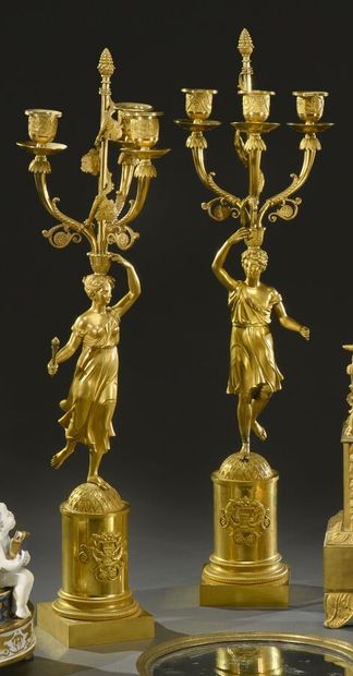 null Beautiful pair of ormolu torchères with a couple in antique costume holding...