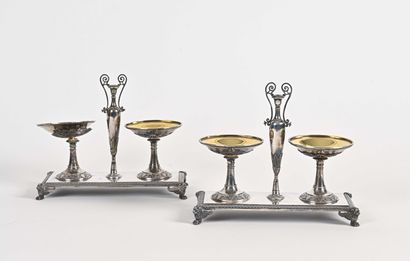 null A pair of beautiful silver double saltcellars, the gilt bowls supported by an...