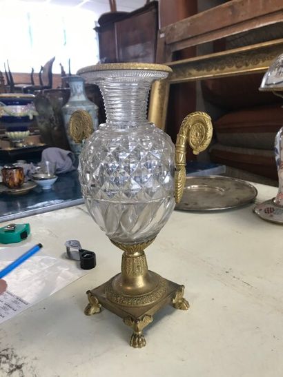 null A crystal baluster vase cut with diamond points and twisted lanceolae, the gilt...