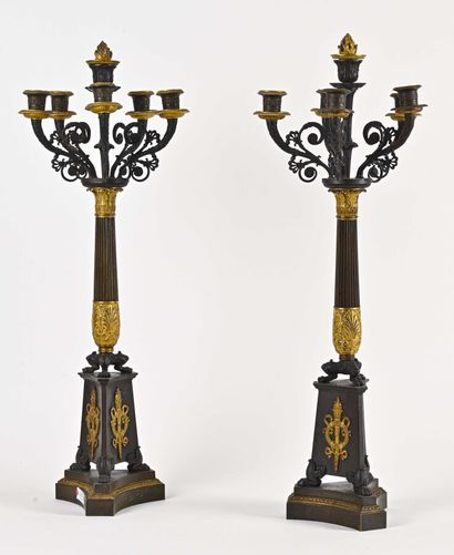 null A pair of large triangular torchieres with scalloped sides and an applied torch...