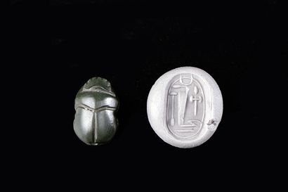 null Scarab engraved with hieroglyphic inscriptions. Pierced.

Ramesside period,...