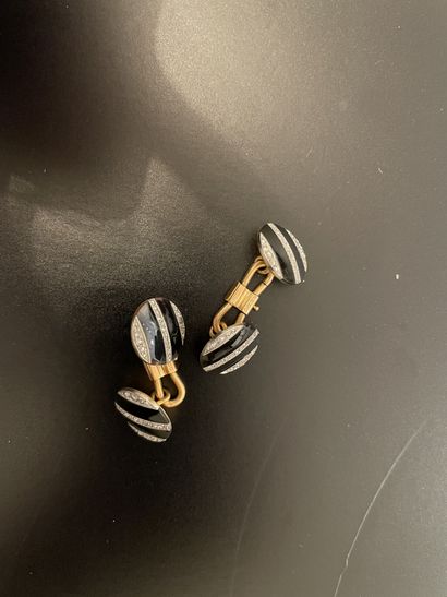 null Paire de boutons de manchettes en or jaune et or gris 18k (750 millièmes), les...