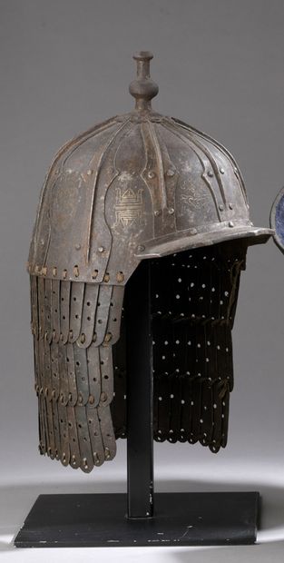 null Iron helmet made of riveted plates, seven main ones reinforced by others covering...