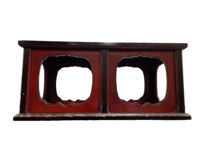null Rectangular coffee table in black and red lacquer, the sides openwork with large...