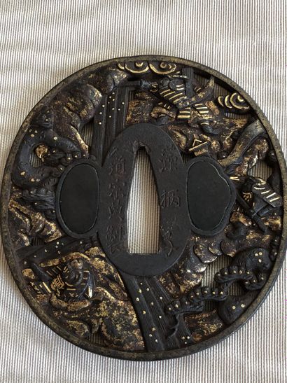 null Two iron tsuba, maru gata with sukashi decoration with gilded copper inlays,...
