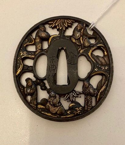 null Two tsuba in maru gata iron with sukashi decoration with gilded copper highlights,...