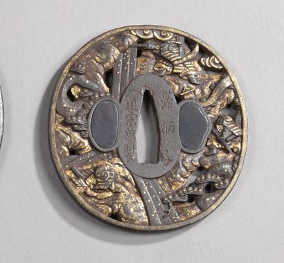 null Two iron tsuba, maru gata with sukashi decoration with gilded copper inlays,...