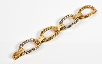 Bracelet en or deux tons 18K (750°/°°)à décor...