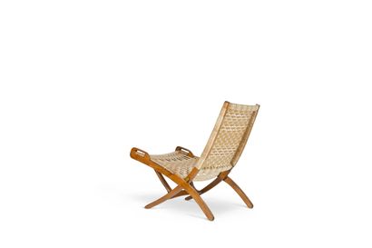 null Ebert WELS (XXth century)

Folding armchair. Structure in mahogany and brass...