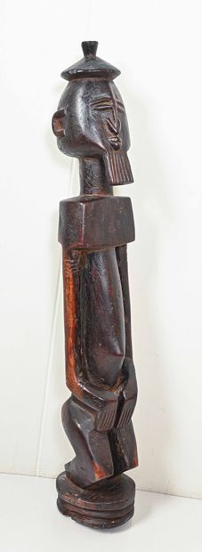 Statuette africaine en bois patiné 
Sage...