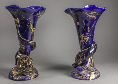  Paire de vases en céramique émaillée bleu et or à décor en relief de tritons enroulés...