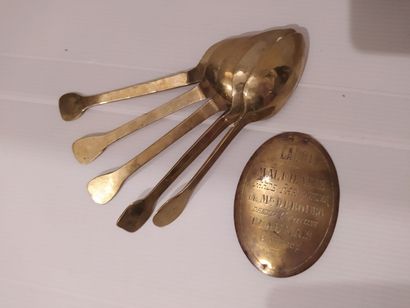 null Five brass spoons. One stamped with three crowned hearts.


We join a plate...